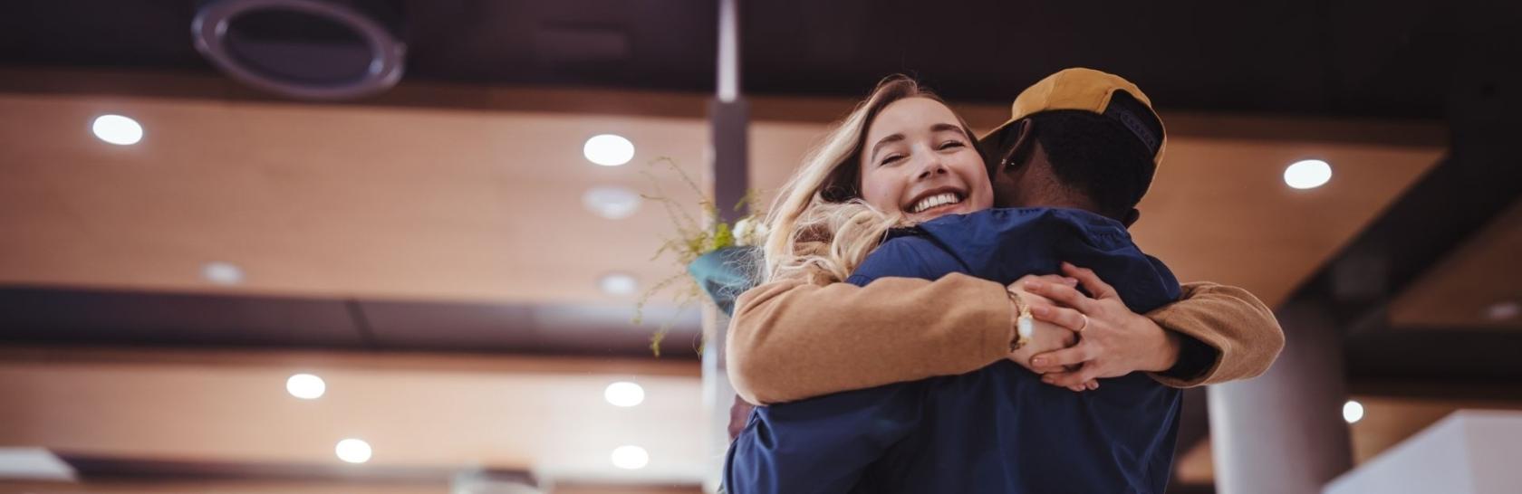 Man and woman hugging each other